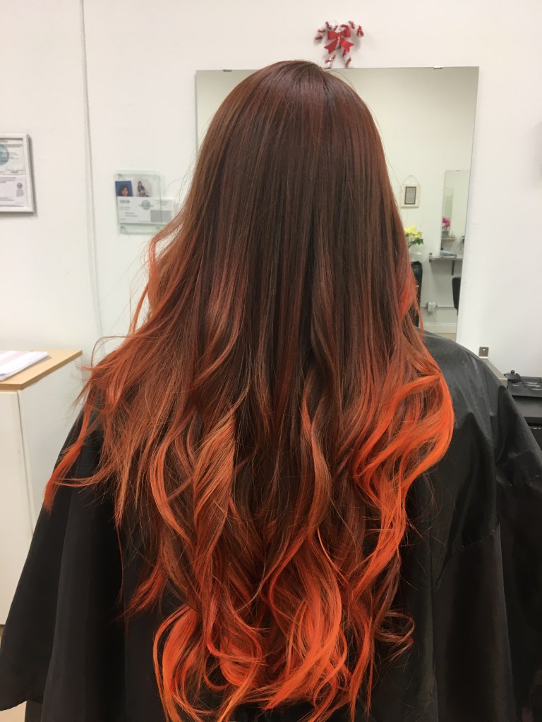 long straight hair with curly bottom and hombre from brown to orange