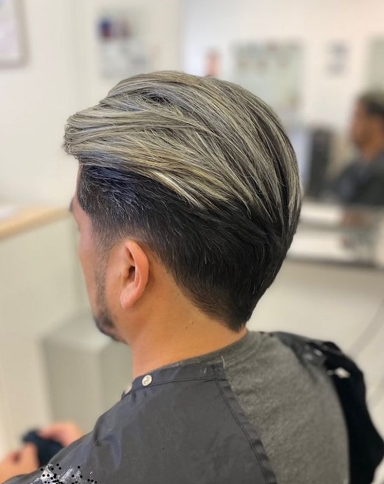 men haircut with blonde top and black low fade bottom